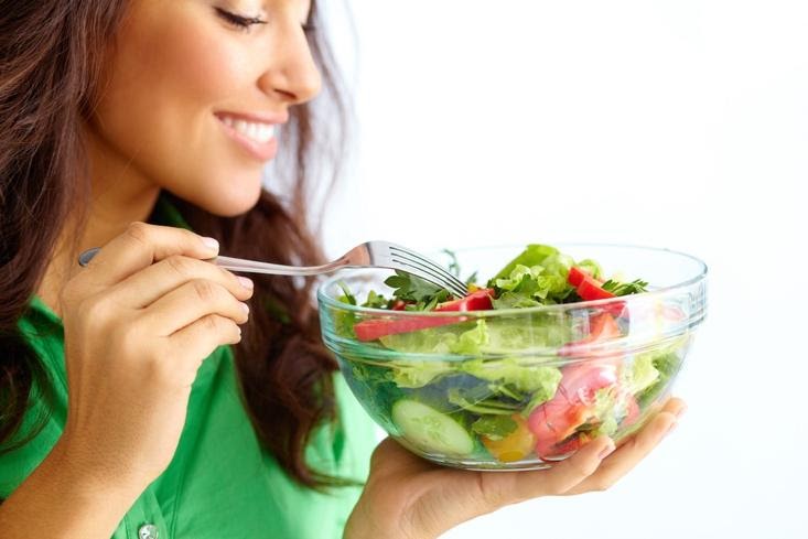 A person eating a salad

Description automatically generated with medium confidence